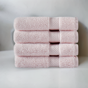 Soft beige SaaSoh Klassic Collection bath towel with plush texture and subtle striped pattern, displayed folded on a clean surface.