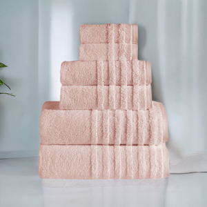 Soft, plush SaaSoh Opulent Collection bath towels in elegant white, shown folded and hanging on a towel rack.
