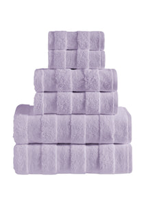 Set of six orchid-colored SaaSoh Apogee Collection luxury bath towels displayed folded and stacked.
