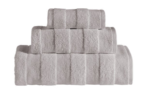 Soft ice grey SaaSoh Apogee Collection luxury bath towels folded neatly on a clean surface.
