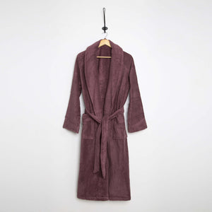SaaSoh Aspen Collection cherry wine bathrobe hanging on a hook, soft fabric and cozy fit displayed in the image.