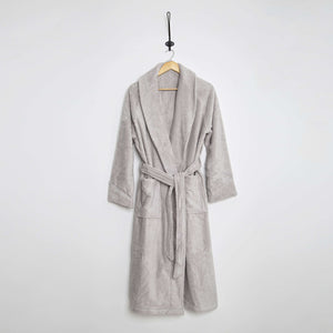 SaaSoh Aspen Collection bathrobe in fog grey, soft and cozy, made from plush fabric, displayed hanging on a wooden hook.