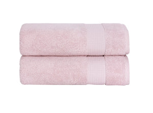 Set of two SaaSoh Milano Collection bath towels in soft, plush fabric, displayed on a bathroom rack.
