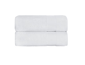 White Milano Collection bath towels by SaaSoh, shown folded with soft, plush fabric and subtle stitching details.