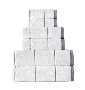 Set of six grey SaaSoh Raya Collection bath towels displayed folded and stacked, showcasing soft, plush fabric quality.