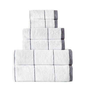 Set of six SaaSoh Raya Collection purple bath towels displayed folded and stacked for luxurious bathroom use.