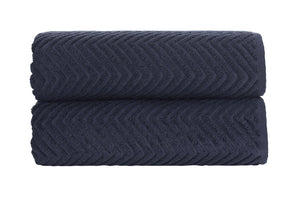 Set of two SaaSoh Venice Collection luxury jacquard bath towels in deep ink blue with intricate woven patterns.
