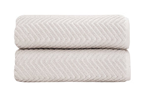 Luxurious SaaSoh Venice Collection bath towels in sand and shell jacquard weave, soft and plush for everyday comfort.