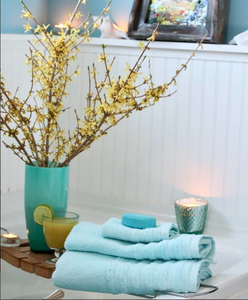Cream-colored SaaSoh Opulent Collection bath towel with plush, luxurious texture, folded neatly on a white background.