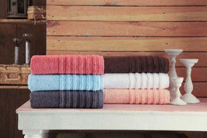 Soft beige SaaSoh Opulent Collection bath towel folded neatly, showcasing plush texture and luxurious quality.